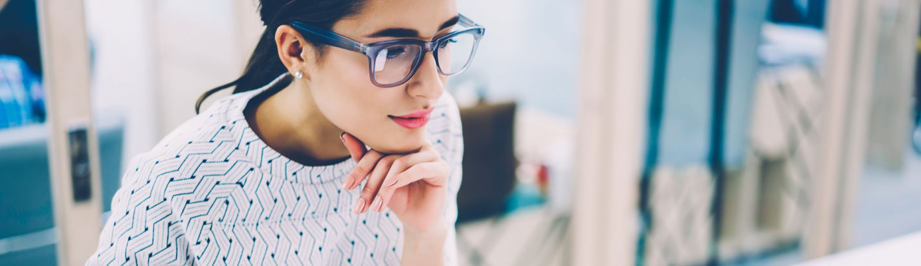 professional woman looks at computer screen