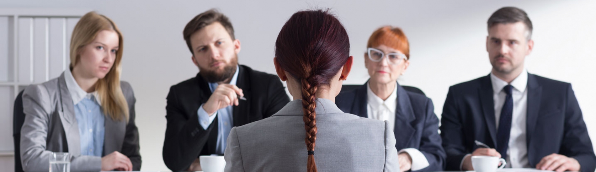 woman interviewing in front of a panel