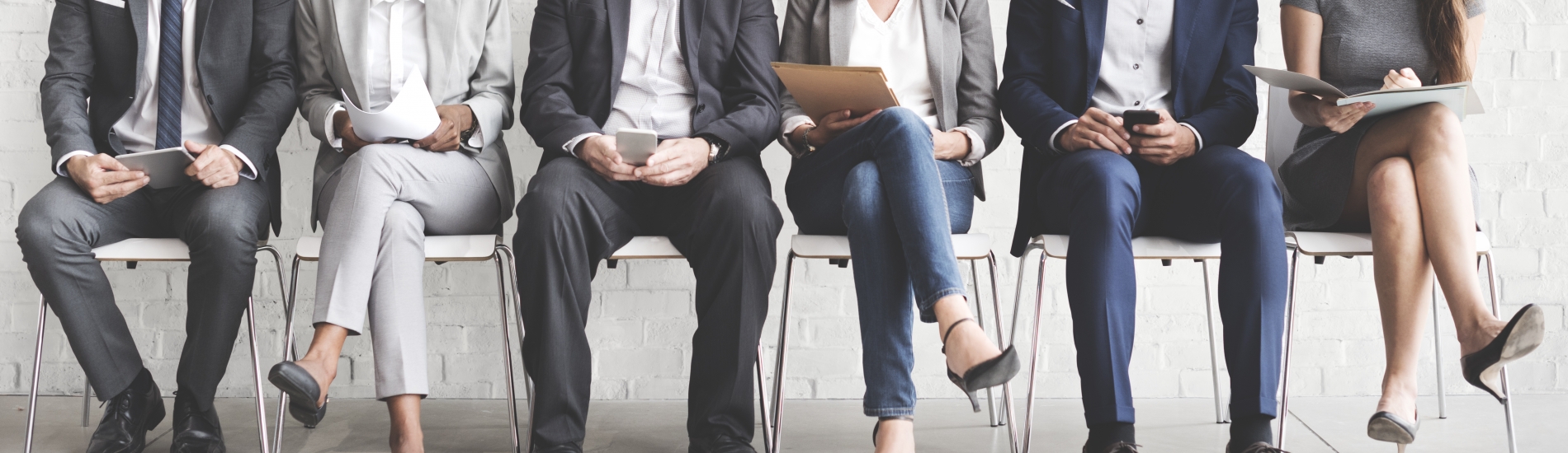 interview candidates seated in chairs